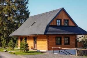 Wooden house under the bell tower